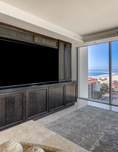A living room with large windows overlooking the ocean.